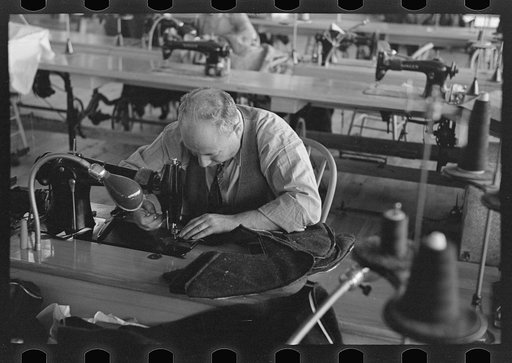 Closeup of cloak operator in cooperative garment factory at Jersey Homesteads, Hightstown, New Jersey