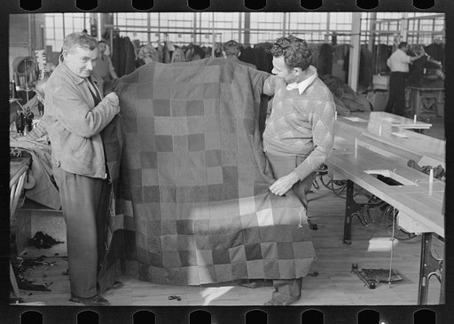Harry Kaplan (right) showing blanket which he has made from waste scraps of cloth. Jersey Homesteads, Hightstown, New Jersey