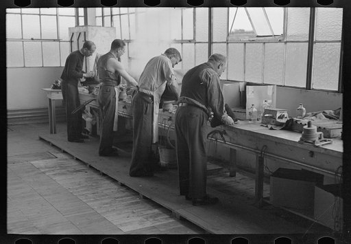Molding hats in the millinery department of the cooperative garment factory at Jersey Homesteads