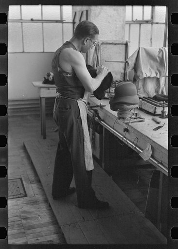Molding hats in the millinery department of the cooperative garment factory at Jersey Homesteads