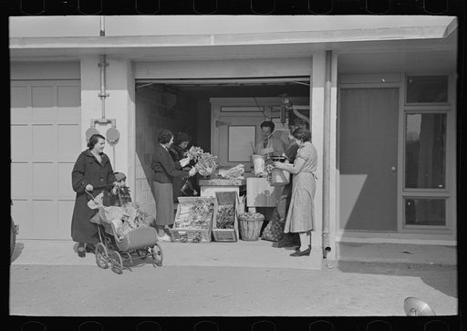 Untitled photo, possibly related to: Consumer's cooperative. The homesteaders have their own kosher meat shop and grocery, which they expect to enlarge as the colony grows. This picture shows manager, Nathan Dubin, doing a flourishing business in his temporary store. Jersey Homesteads, Hightstown, N