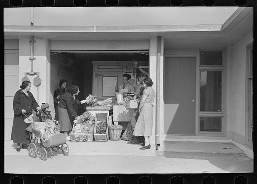 Untitled photo, possibly related to: Consumer's cooperative. The homesteaders have their own kosher meat shop and grocery, which they expect to enlarge as the colony grows. This picture shows manager, Nathan Dubin, doing a flourishing business in his temporary store. Jersey Homesteads, Hightstown, N
