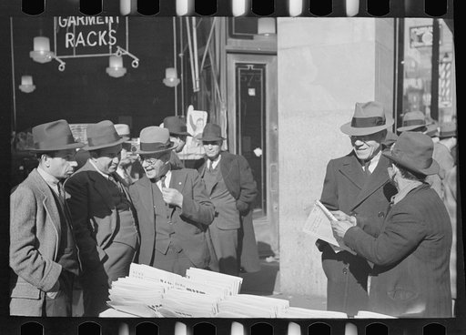 Group of men on 7th Avenue and 28th Street, New York City