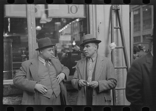 Two men in conversation, 7th Avenue near 38th Street, New York City