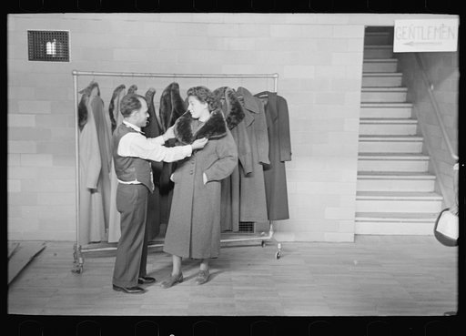 Measuring girl for a coat in cooperative garment factory at Jersey Homesteads, Hightstown, New Jersey