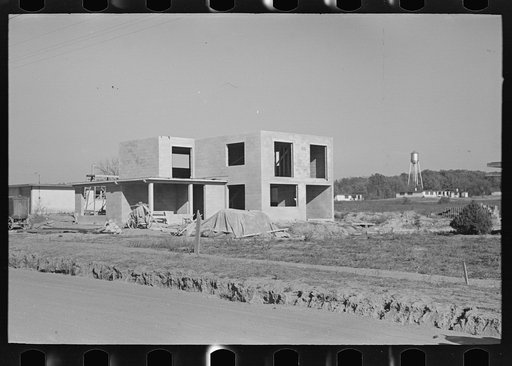 New type of two-story house under construction. Stucco coat has just been applied, Jersey Homesteads, Hightstown