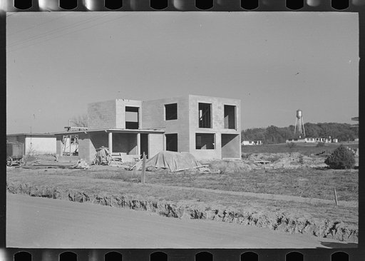 Untitled photo, possibly related to: New type of two-story house under construction. Stucco coat has just been applied, Jersey Homesteads, Hightstown
