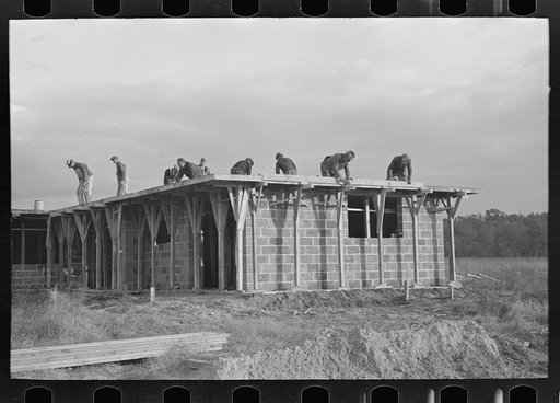 Untitled photo, possibly related to: Men working on roof of house under construction, Jersey Homesteads, Hightstown, New Jersey