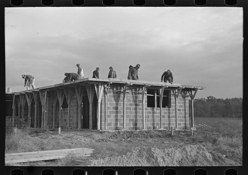 Untitled photo, possibly related to: Men working on roof of house under construction, Jersey Homesteads, Hightstown, New Jersey