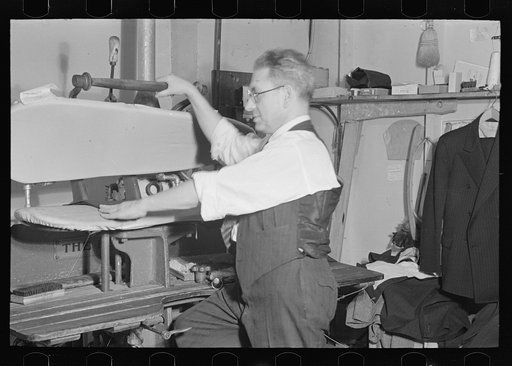 Untitled photo, possibly related to: Proprietor of tailor shop at steam presser, University Place near 11th Street, New York City