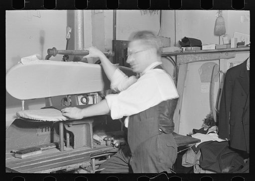 Untitled photo, possibly related to: Proprietor of tailor shop at steam presser, University Place near 11th Street, New York City