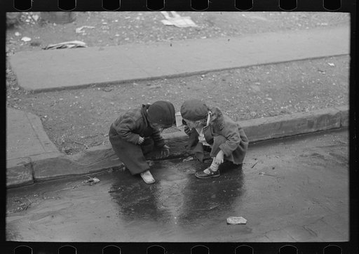Children playing in the gutter on 139th Street just east of St. Anne's Avenue, Bronx, New York