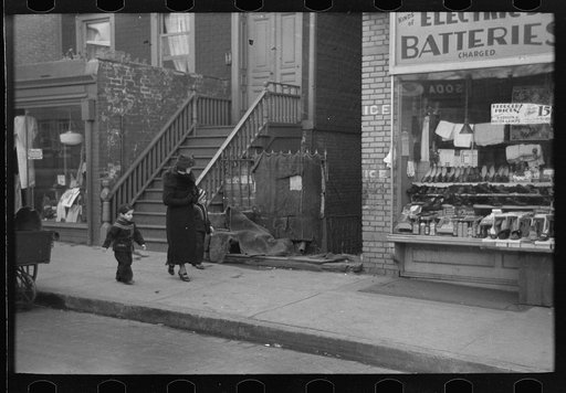 Untitled photo, possibly related to: Mothers talking together and child playing in the gutter, 139th Street just east of St. Anne's Avenue, Bronx, New York