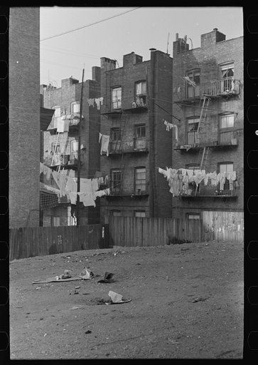 Apartment houses as viewed through vacant lot. In vicinity of 139th Street, just east of St. Anne's Avenue, Bronx, New York City