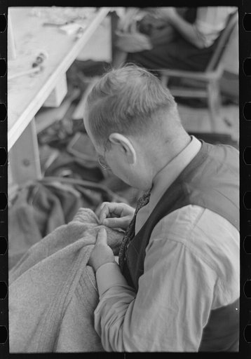 Untitled photo, possibly related to: Closeup of tailor in garment factory, Jersey Homesteads, Hightstown, New Jersey