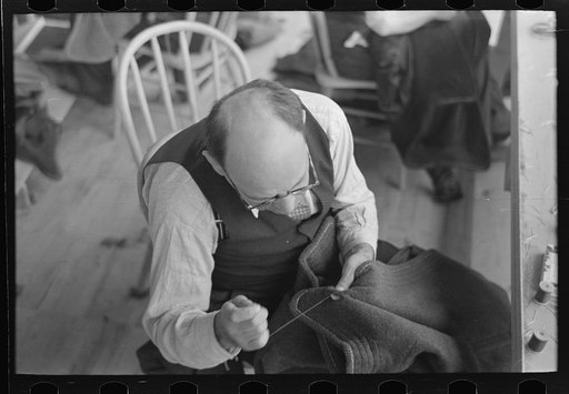 Closeup of tailor in garment factory. Jersey Homesteads, Hightstown, New Jersey