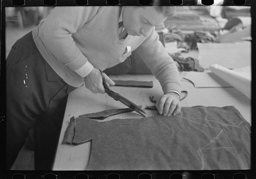 Closeup of cutter's hands (cutting cloth), Jersey Homesteads, Hightstown, New Jersey