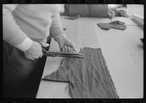 Closeup of cutter's hands (cutting cloth), Jersey Homesteads, Hightstown, New Jersey