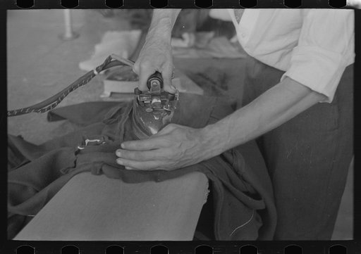 Untitled photo, possibly related to: Closeup of presser's hands, Jersey Homesteads factory, Hightstown, New Jersey