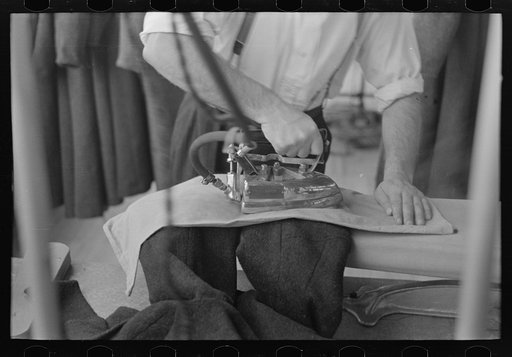 Closeup of presser's hands, Jersey Homesteads factory, Hightstown, New Jersey