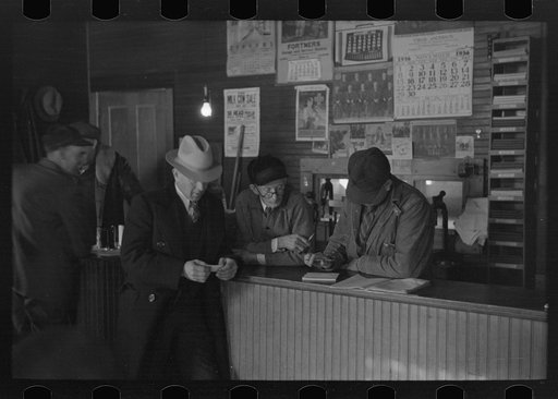 The weighmaster, his assistant and customers, weighing-in room, Aledo, Illinois