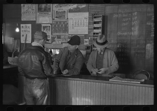 Clerks and clients at the weighing-in room, stockyards, Aledo, Illinois