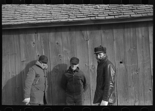 Untitled photo, possibly related to: Farmers in shed at country auction near Aledo, Mercer County, Illinois