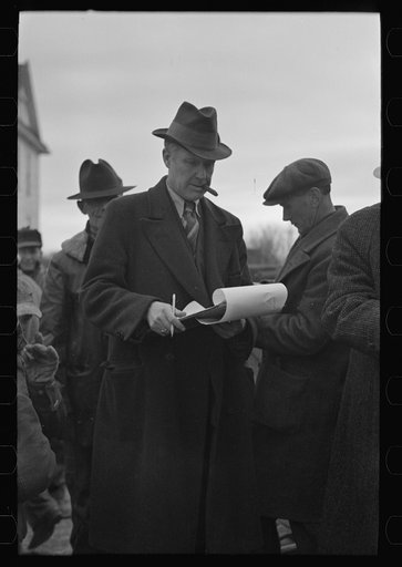 Clerk at country auction sale near Aledo, Illinois