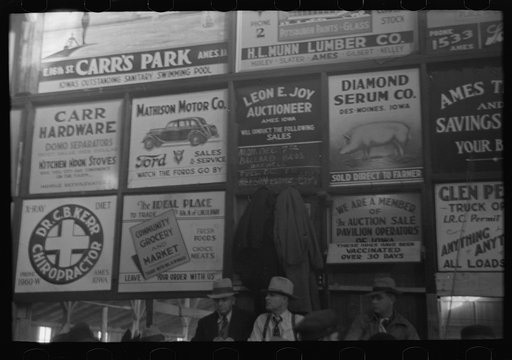Untitled photo, possibly related to: Advertising displays at livestock hall, Ames, Iowa