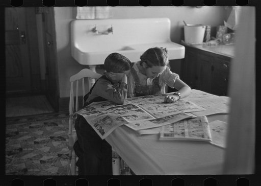 Untitled photo, possibly related to: Children reading Sunday papers, Rustan brothers' farm near Dickens, Iowa. Note convenience of running water in background. This farm was formerly owner operated but they are now tenants of Metropolitan Life
