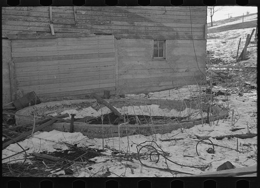 Remains of a silo on a 160 acre farm owned and operated by J.E. Herbrandson. The farm is now under heavy mortgage. An adequate windbreak on this farm would have prevented the silo from blowing down