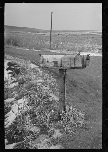 Mail boxes on wheel near Wallingford, Iowa