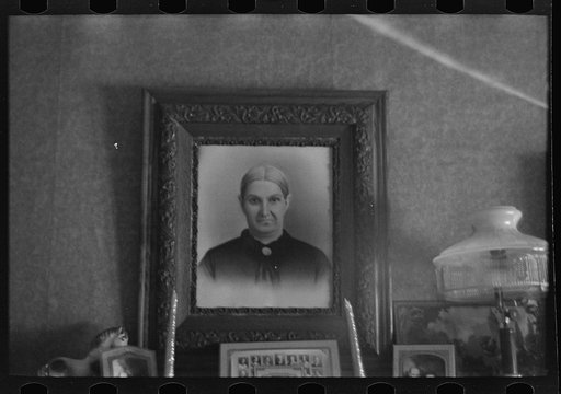 Family portrait in home of Fred Rowe, farmer near Estherville, Iowa