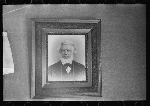 Family portrait in home of Fred Rowe, farmer near Estherville, Iowa