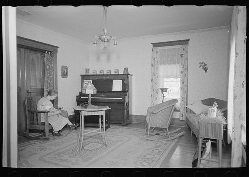 Living room of Levi Mills farmhouse near Spencer, Iowa. This eighty acre farm is rented from a retired farmer