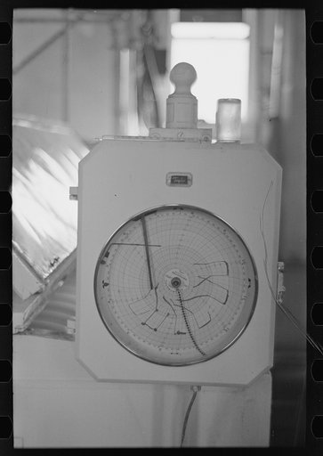 Automatic recording thermometer in cooperative creamery at Ruthven, Iowa. The latest scientific instruments are used here