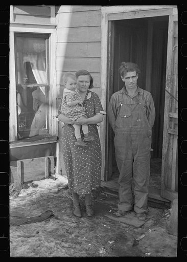 Untitled photo, possibly related to: Mr. Rauhauser, wife and one of his seven children, Ruthven, Iowa. He works as a farm hand. At present he is out of work. He has made application for direct relief