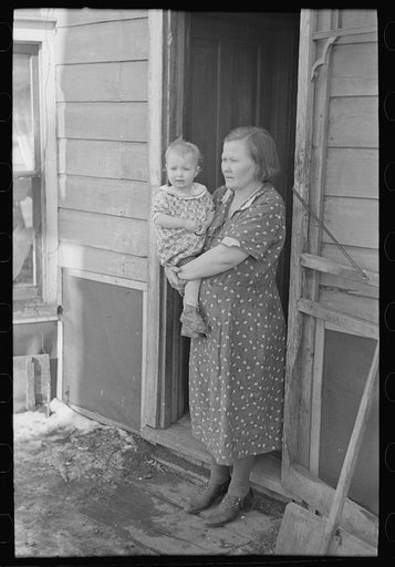 Untitled photo, possibly related to: Mr. Rauhauser, wife and one of his seven children, Ruthven, Iowa. He works as a farm hand. At present he is out of work. He has made application for direct relief