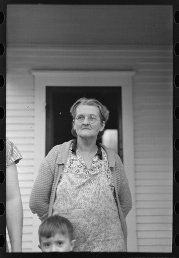 Mrs. Theodore F. Frank, wife of a formerly prosperous farm owner. The farm is now owned by a loan company and the family is left with very little resources