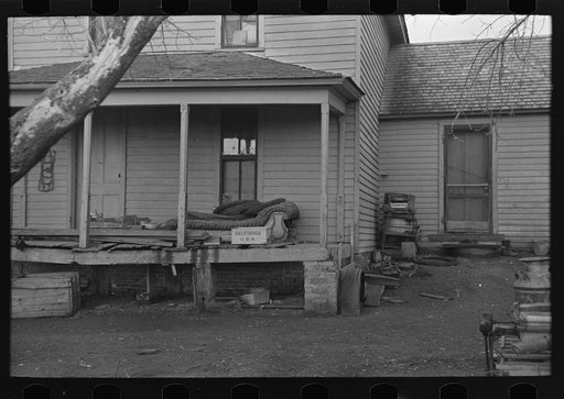 Front porch of house occupied by Mrs. Mary Kelsheiner and sons, Miller Township, Woodbury County, Iowa