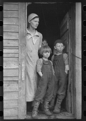 Untitled photo, possibly related to: Mrs. Frank Moody with two of her seven children on their eighty acre farm in Miller Township, Woodbury County, Iowa