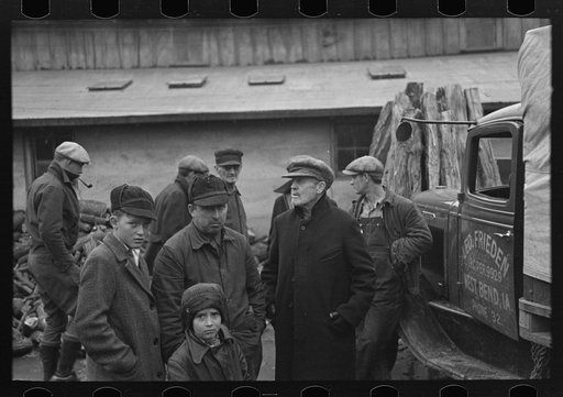 A group of farmers on livestock sales day in Mapleton, Iowa
