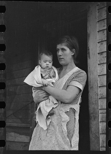 Mrs. Atkinson and baby. Atkinson rents from an estate and has eighty acres of very poor land on which to support his family of nine. Mrs. Atkinson walked fifteen miles to the relief office to get aid for the family, near Shannon City, Ringgold County, Iowa