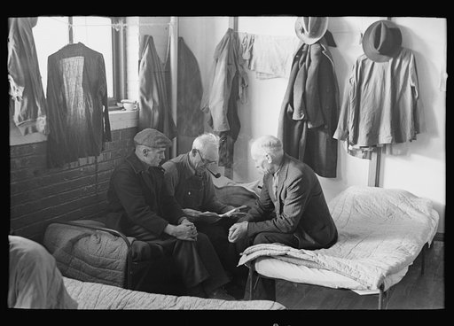 Man reading to fellow inmates, homeless men's bureau, Sioux City, Iowa