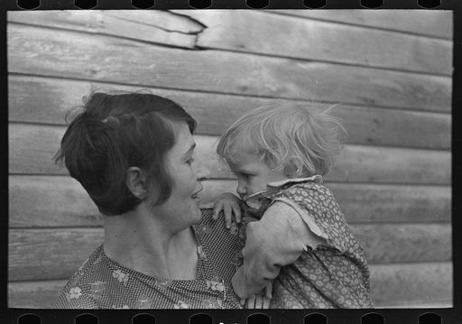 Untitled photo, possibly related to: Mrs. Ed Boltinger and one of her children on farm near Ringgold, Iowa