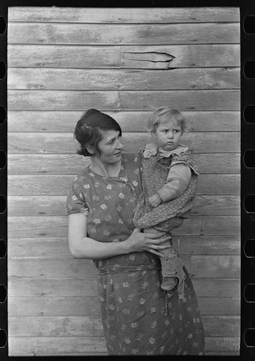Mrs. Ed Boltinger and one of her children on farm near Ringgold, Iowa