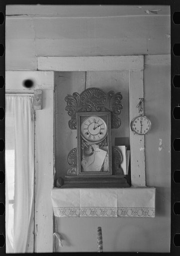 Clock in the home of John Landers, a farmer living near Marseilles, Illinois