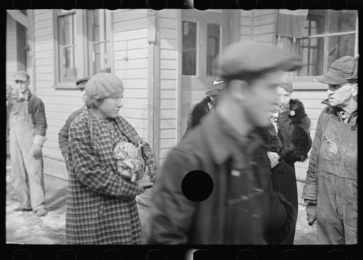 Untitled photo, possibly related to: A group of flood refugees on the streets of McLeansboro, Illinois