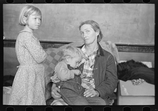 Mother and two children, flood refugees in the schoolhouse at East Prairie, Missouri