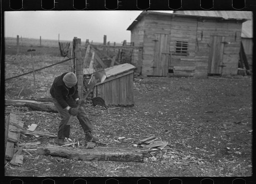 Untitled photo, possibly related to: Late afternoon. One of Tip Estes' sons loading tiles on a wagon, Fowler, Indiana